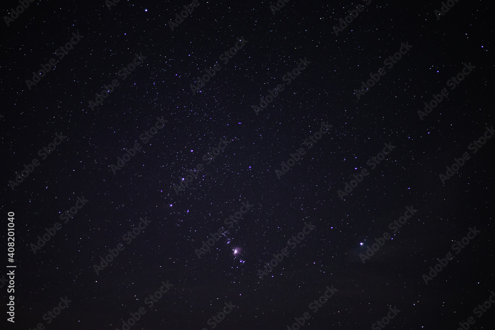 The constellation of Orion in the night starry sky. Starry sky background