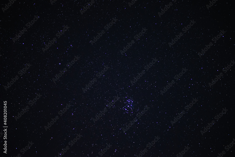 Starry sky on a summer night with the stars of the Pleiades cluster