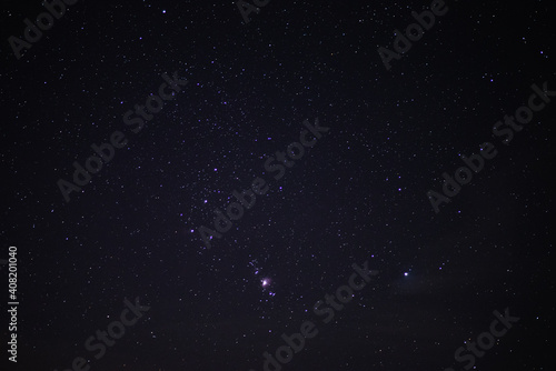 Obraz na płótnie The constellation of Orion in the night starry sky. Starry sky background w salonie