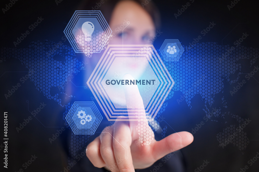 Business, Technology, Internet and network concept. Young businessman working on a virtual screen of the future and sees the inscription: Government Business, Technology, Internet and network concept. Young businessman working on a virtual screen of the future and sees the inscription: Government