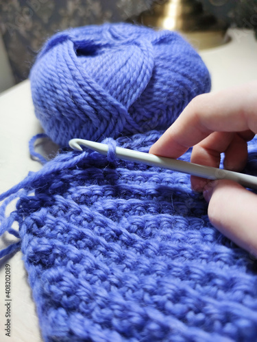 Knitting crochet wool acrylic violet purple yarn thread hook craft creative closeup macro photo