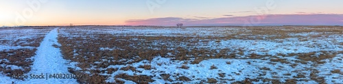  Wide Panoramic Landscape View of Prairie Grassland at Nose Hill Urban Park with Crimson Sunset Sky on Horizon in Calgary, Canada