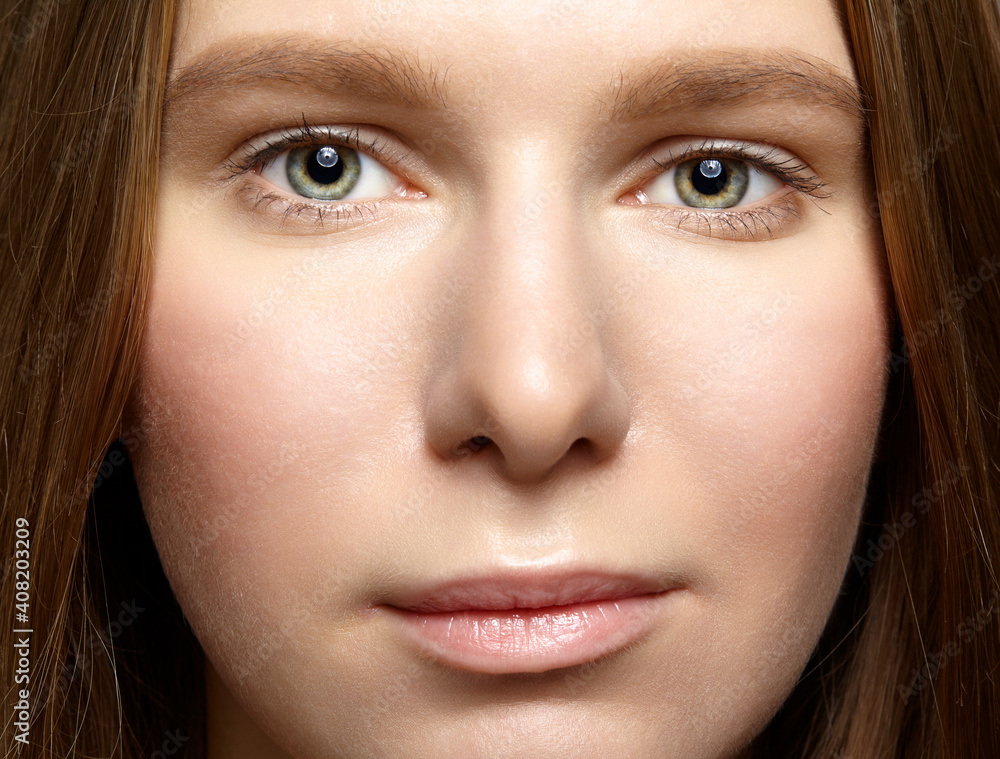 Closeup macro shot of human female face. Closeup macro shot of human female face.