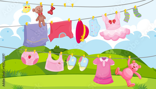 Children clothes on a clothesline with children accessories in the outdoor scene