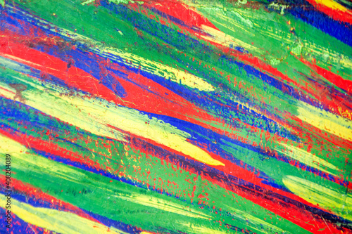 Background from different strokes of red, yellow, green and blue paint