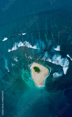 Aerial Drone Tiny Sandy Island with Palm Trees & Waves & Reef Tropical Island photo