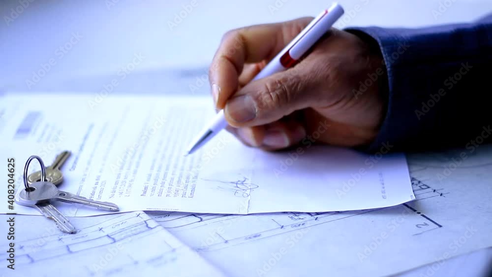 man signing a contract for a newly purchased house stock video stock footage man signing a contract for a newly purchased house stock video stock footage