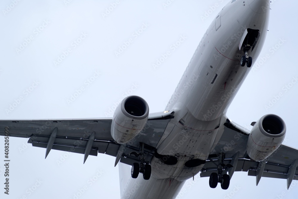Fototapeta premium The Underside Of A Modern Airplane And Its Landing Gear