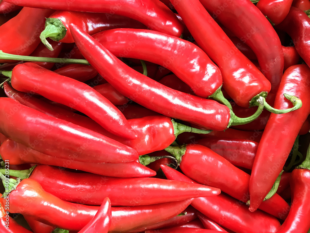 Red hot peppers. Ripe vegetables. Background for the store.