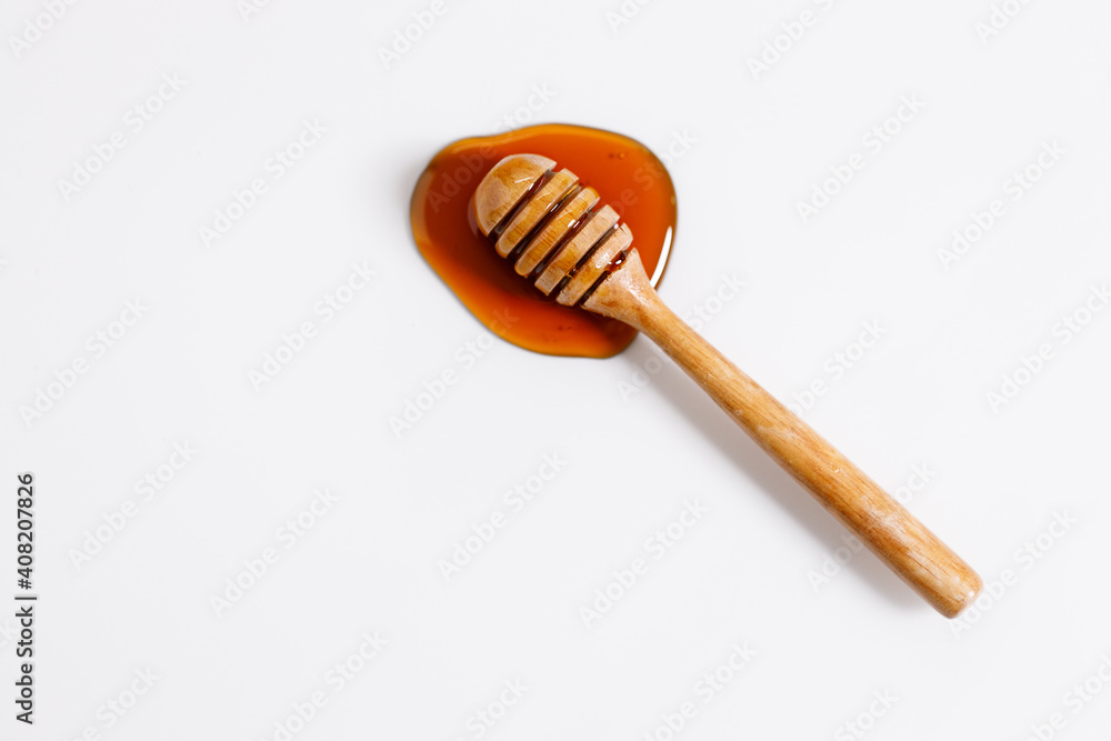 Fresh honey with bamboo dipper Fresh honey with bamboo dipper