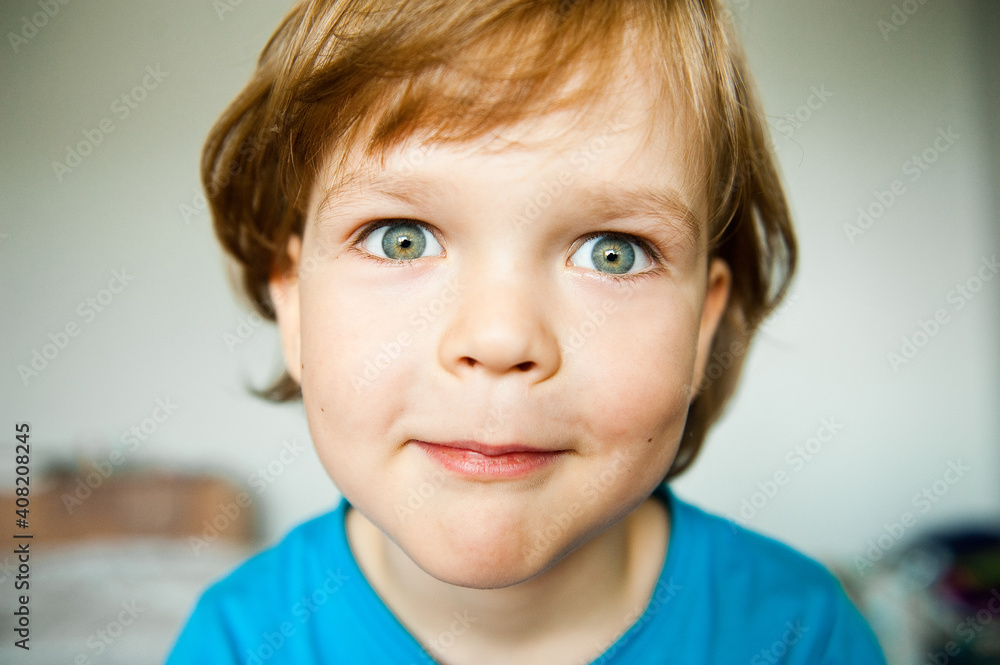 Funny portrait of a little boy looking into the camera. Funny portrait of a little boy looking into the camera.