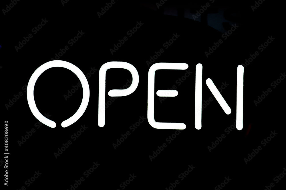 'OPEN' neon sign on black background 'OPEN' neon sign on black background