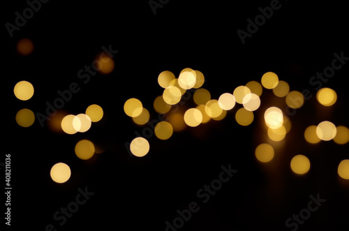 blurry yellow round lights on a dark background