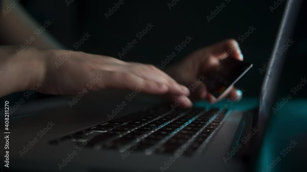 Hands holding credit card and shopping online. Easy pay using digital gadget. Girl using laptop. E-bank concept. Shot in 6K. Hands holding credit card and shopping online. Easy pay using digital gadget. Girl using laptop. E-bank concept. Shot in 6K.