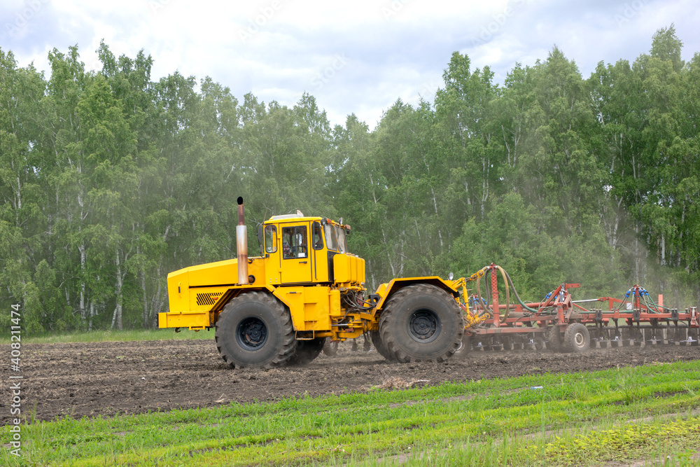 Combine harvester machine. concept of agriculture and husbandry. pre seeding activities. cultivating field Combine harvester machine. concept of agriculture and husbandry. pre seeding activities. cultivating field