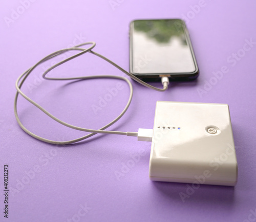 Cellphone getting charged from power bank.