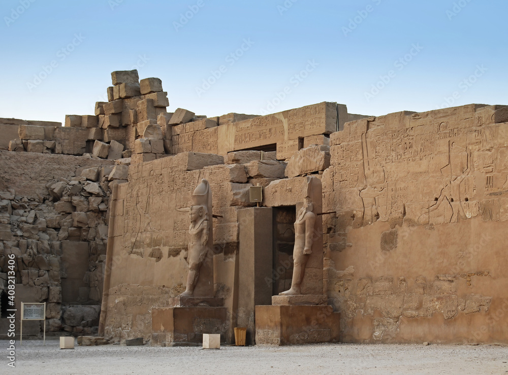 Ancient statue and hieroglyph in the temple of Karnak. Egypt
