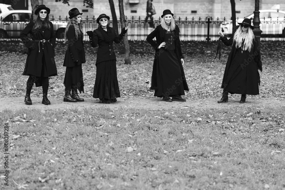 Five women as witches go to the Sabbath, a group of witches or Goths