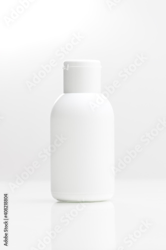 close up of a white bottle on white background. cosmetic mock up. branding identity mockup concept.