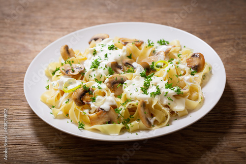 plate of pasta with cream sauce and mushrooms