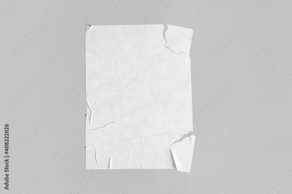 Blank creased paper sheet on grey background