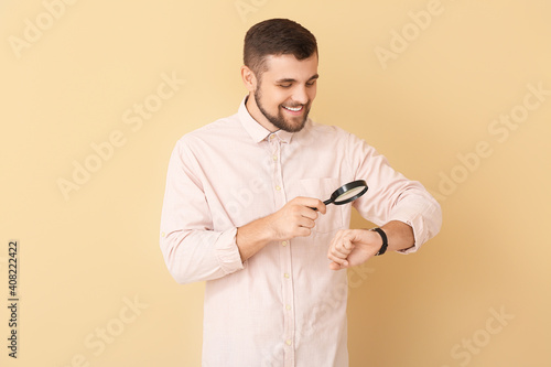 Handsome man looking at wri...
