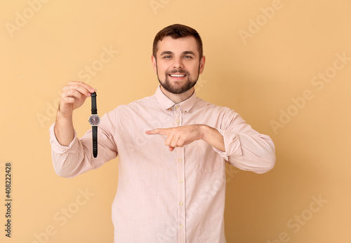Handsome man pointing at st...