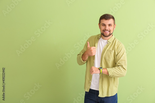 Handsome man with wristwatc...