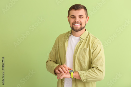 Handsome man with wristwatc...