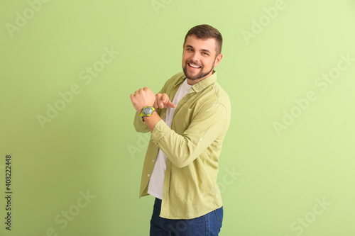 Handsome man with wristwatc...