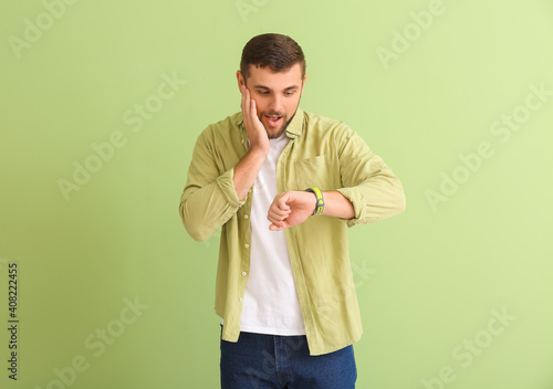 Stressed man looking at wri...