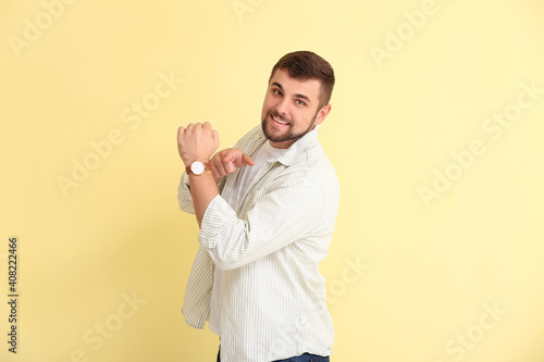 Handsome man pointing at wr...