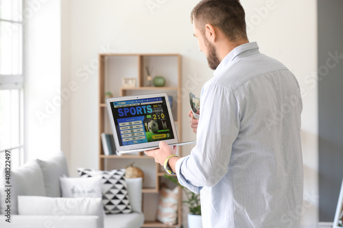 Young man placing sports be...