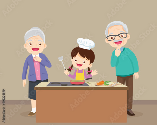 elderly happy looking at child girl cooking in kitchen