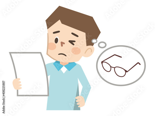 文字が読みにくい老眼の男性