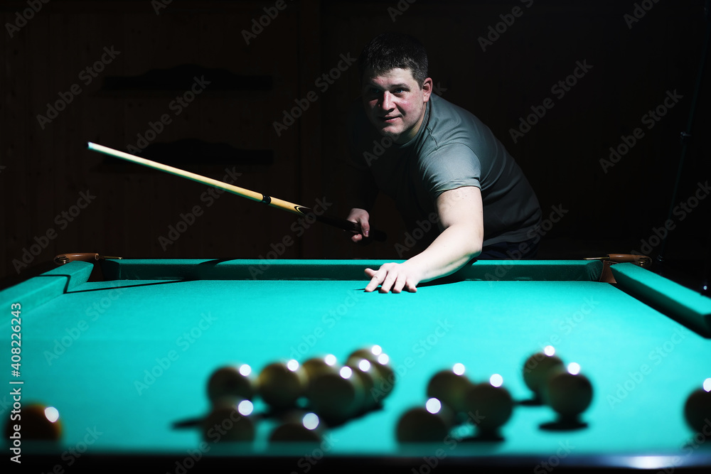 Fototapeta premium Billiard club. Gambling table with russian billiard set and dark cue ball. Russian pyramid (Russian billiard, pyramid billiards), cue sport.