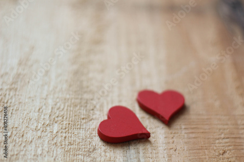 Two red Hearts for Valentine`s day concept on wood background. Love background