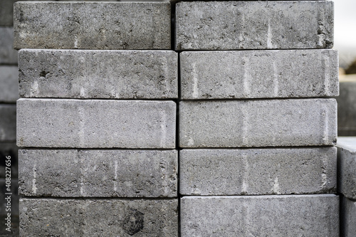 Closeup cement bricks block are stacked on site prior to construction.