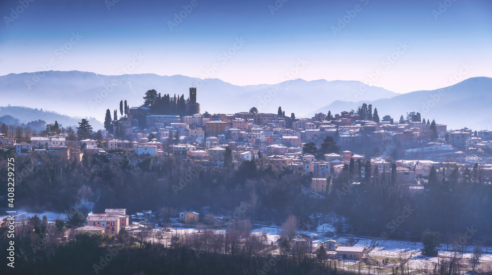 Barga snowy village in winter. Garfagnana, Tuscany, Italy.