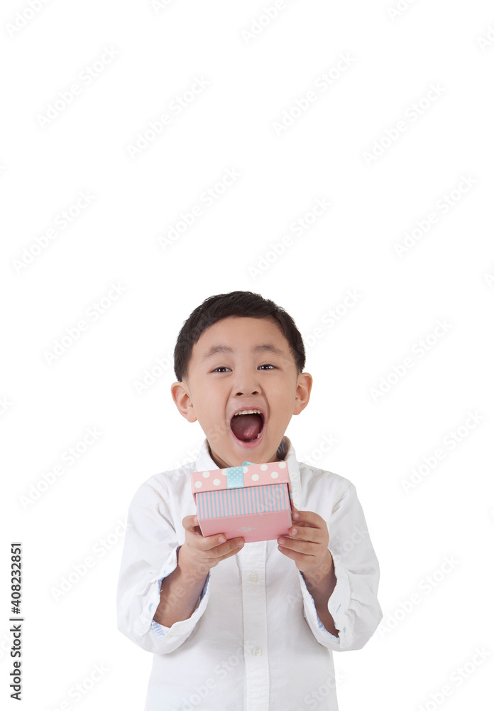 The little boy holding a gift box The little boy holding a gift box