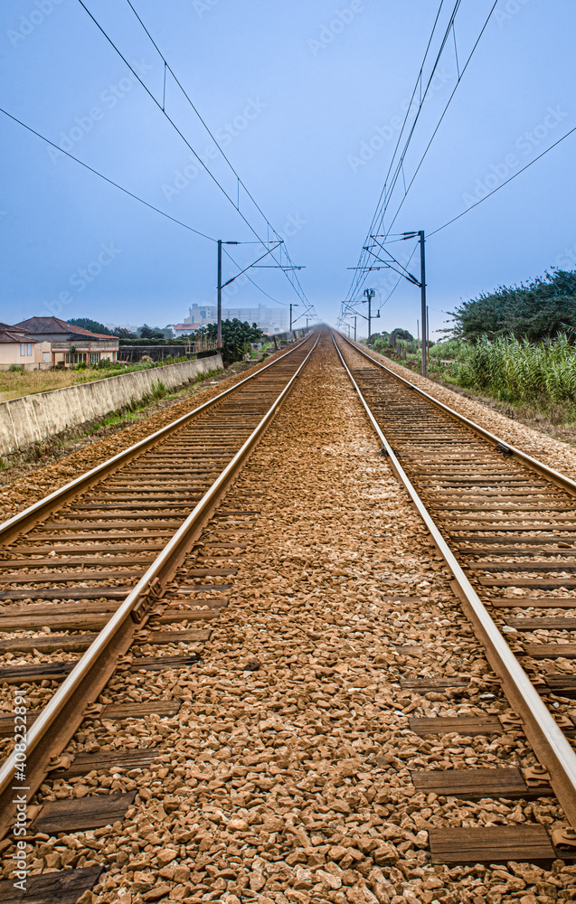 Ancient railway with double direction tracks in perspective Ancient railway with double direction tracks in perspective