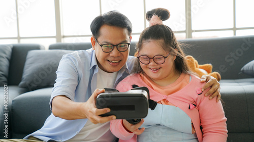 Down syndrome happy family, Parents play a fun driving game.