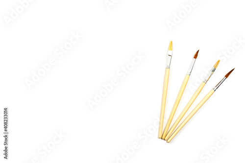 Paint brushes isolated on white with copy space.