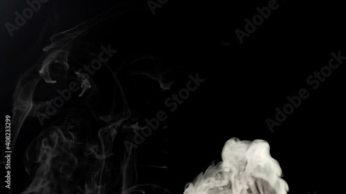 White smoke on a black background. Slow motion. Vape smoke. Vapor , fog, ice smoke cloud , realistic smoke cloud best for using in 4k composition. Overlay (footage Background) for different projects