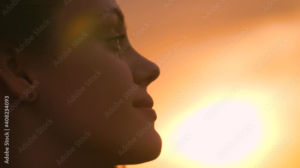 Portrait of a happy young teenager girl on the street. The girl dreams with pleasure with her eyes closed. The lady feels free, successful, ready to start the day, move forward. Portrait of a happy young teenager girl on the street. The girl dreams with pleasure with her eyes closed. The lady feels free, successful, ready to start the day, move forward.