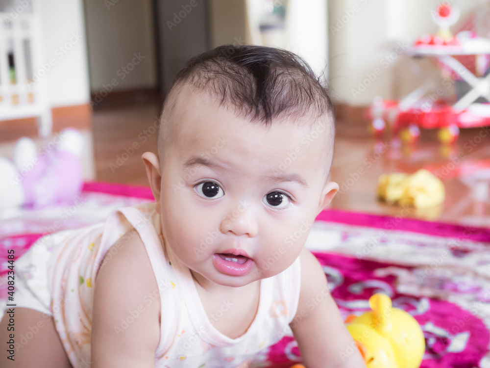 Portrait child little boy 6 months old with have have 2 teeth on blur image. he smile happy. cute and authentic. baby thai concept. Portrait child little boy 6 months old with have have 2 teeth on blur image. he smile happy. cute and authentic. baby thai concept.