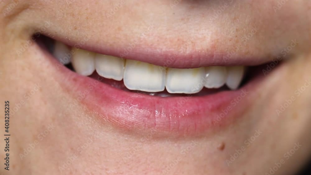 Close up of smiling woman with natural smile Close up of smiling woman with natural smile