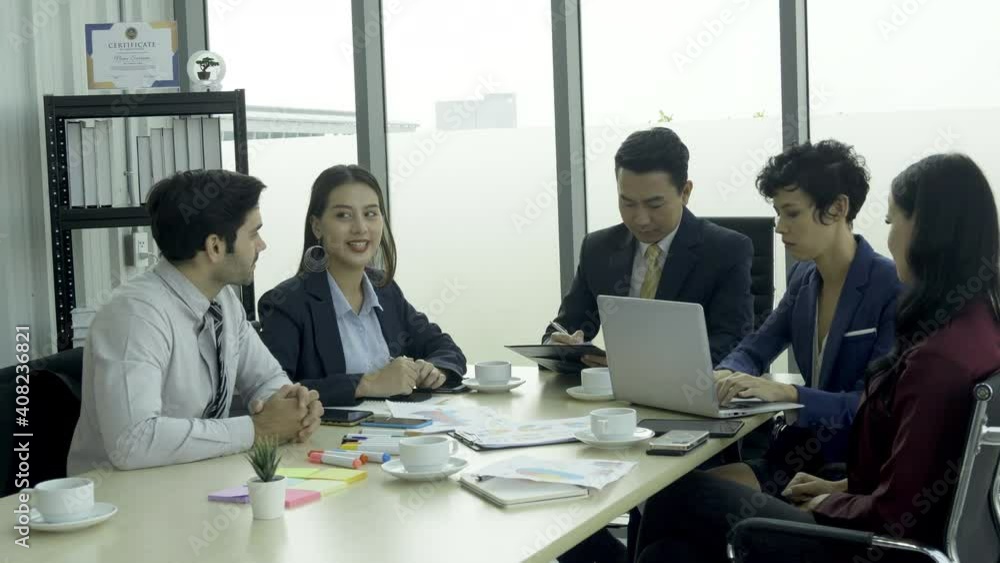 Business people work together at office. They discuss business plans together. Business people work together at office. They discuss business plans together.