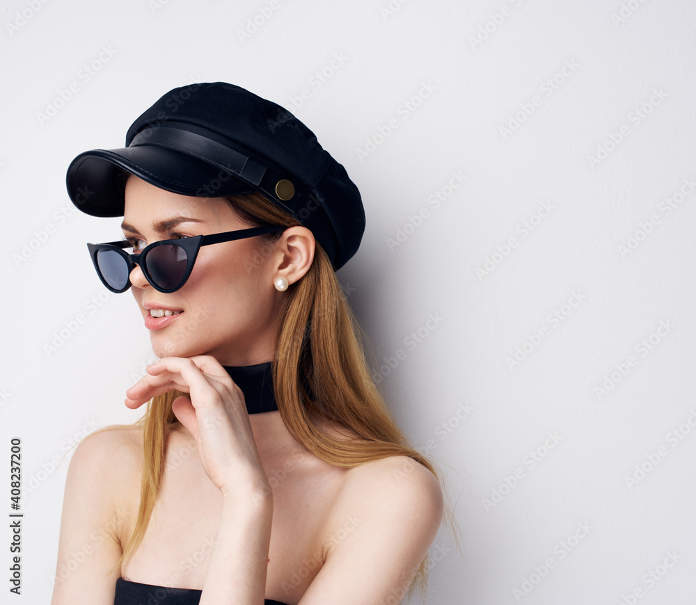 Elegant woman in sunglasses black cap fashion studio Glamor Cosmetics Elegant woman in sunglasses black cap fashion studio Glamor Cosmetics