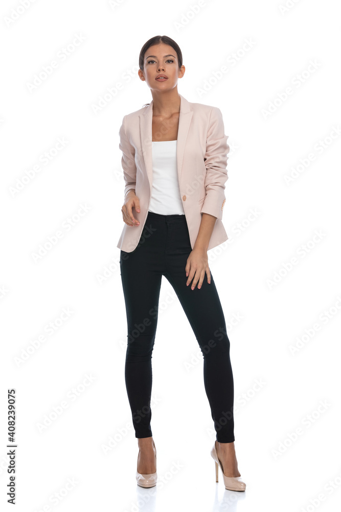 cool fashion woman in pink jacket holding hands in a fashion pose cool fashion woman in pink jacket holding hands in a fashion pose